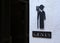 Toilet male signs on the abstract white rough cement wall background