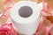 Toilet paper with beautiful pink rose flowers