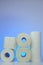 Toilet paper and napkins. Hygiene and cleanliness. Rolls of toilet paper and napkins on blue background. Hygienic items