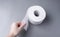 toilet paper roll. soft tissue paper. Large details of one clean roll of toilet paper lie on a gray background