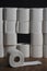 Toilet paper wall with many rolls. before a lonely roll. Soft hygienic paper. Background