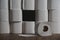 Toilet paper wall with many rolls. before a lonely roll. Soft hygienic paper. Background