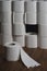 Toilet paper wall with many rolls. before a lonely roll. Soft hygienic paper. Background