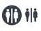 Toilet symbols on white background. White silhouettes in a dark grey circle and dark grey male and female icon on white backgroun