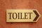 Toilet vintage label on a brown background.
