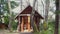 Toilet in wooden house in village. Toilet sign WC hang over building.