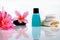 Toiletries with plumeria flower and towel