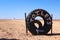 Toilets sign using an old truck tyre.