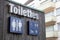 Toilettes french text means wc Toilet sign icon on wooden building facade water-closets wall entrance