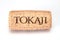 TOKAI, HUNGARY - FEBRUARY 07, 2019: Wine cork of Tokaji wine isolated on white background. Tokai, Hungary