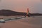 Tokarevsky lighthouse during a colorful dawn against the backdrop of a beautiful sea.