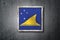 Tokelau flag in concrete wall