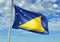 Tokelau flag waving with sky on background realistic 3d illustration