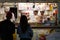 Tokyo, Japan, 04/08/2017: People buy ice cream at a kiosk in the entertainment center on Odaiba Island