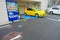TOKYO, JAPAN -28 JUN 2017: Car parked near of juice coin machine and a vending machine meter of car parking for people