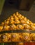 Tokyo, Japan - July 26, 2017: Close up of a beautiful tower of golden ferrero rocher chocolate, in a convention in the