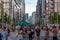 TOKYO, JAPAN - JULY 30 2023: Shoppers on the closed roads of Ginza, the luxury retail district of central Tokyo