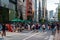 TOKYO, JAPAN - JULY 30 2023: Shoppers on the closed roads of Ginza, the luxury retail district of central Tokyo