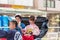 TOKYO, JAPAN - OCTOBER 31, 2017: Couple in a rickshaw on a city street. Copy space for text.