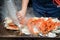 Tokyo, Japan Street in Tsukiji outer market in Ginza with closeup retail sample display of cooked red crab lobster legs white meat