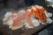 Tokyo, Japan Street in Tsukiji outer market in Ginza with closeup retail sample display of cooked red crab lobster legs white meat