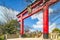 Tokyo Skytree Tower and Kameido Tenjin shrine`s red Torii shinto gate