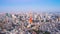 Tokyo tower with buildings in Tokyo City, Japan. camera panning.