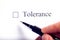 Tolerance - checkbox with a cross on white paper with pen. Checklist concept