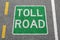 Toll road on a street city town pay paying clean air highway sign zone