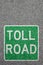 Toll road street city town pay paying clean air portrait format highway sign zone