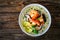 Tom Kha goong soup - coconut shrimp soup with noodles and shiitake mushrooms on wooden table