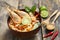 Tom Yam Kung ,Prawn and lemon soup with mushrooms, thai food in wooden bowl top view