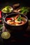 Tom Yam kung Spicy Thai soup with shrimp in a black bowl
