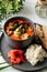 Tom yam soup with seafood and rice with toasts