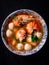 Tom Yum Kung with Pork Balls spicy and sour Colorful, appetizing, put in a container