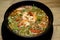 Tom Yum Kung Shrimp soup with milk, meat, fish, mushrooms spicy