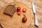 Tomates with black bread for lunch, Black bread with tomato on the wooden background