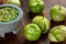 Tomatillos, green tomatoes, with salsa verde, green sauce, in a molcajete