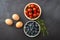 Tomato , blue berry and egg on bowl in  chalkboard background