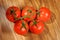 Tomato, bunch of vegetables on a wooden table, view from above