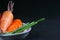Tomato, carrot and spring onion in a dish