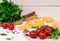 Tomato cherry, pasta, salt, black background basil Italian ingredient spice vegetarian