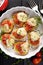 Tomato crostini with mozzarella cheese , oregano and fresh thyme