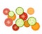 Tomato, cucumber and carrot slices on white background, three part of dish,