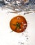 Tomato dropped into water