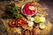 Tomato face pack with all ingredients on wooden surface.