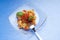 Tomato farfalle and fork