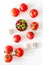 Tomato frame with suase and garlic on white background top-down