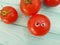 Tomato funny organic concept person eyes cartoon on blue wooden positive emotion