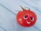 Tomato funny organic person eyes cartoon on blue wooden positive emotion